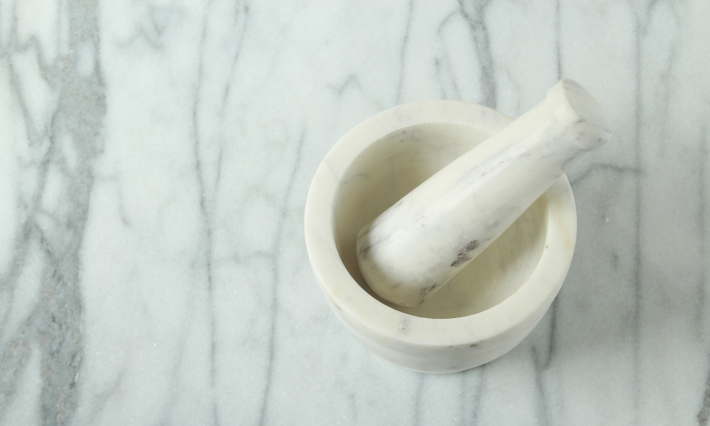 Mortar and pestle on marble countertop