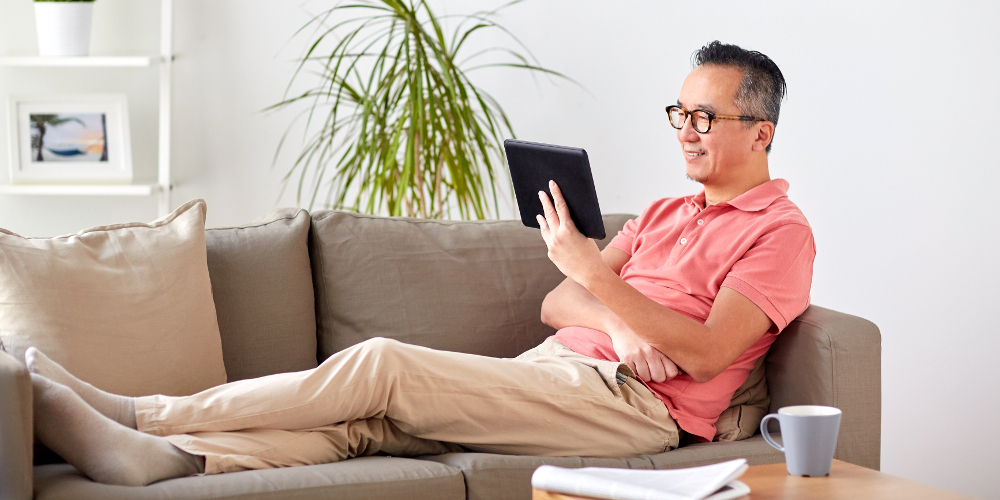 Single and elderly man enjoying a restful time on sofa